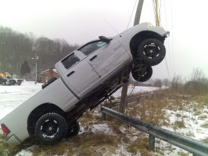Truck forced off road, up guy wire on W.Va. 7; woman charged